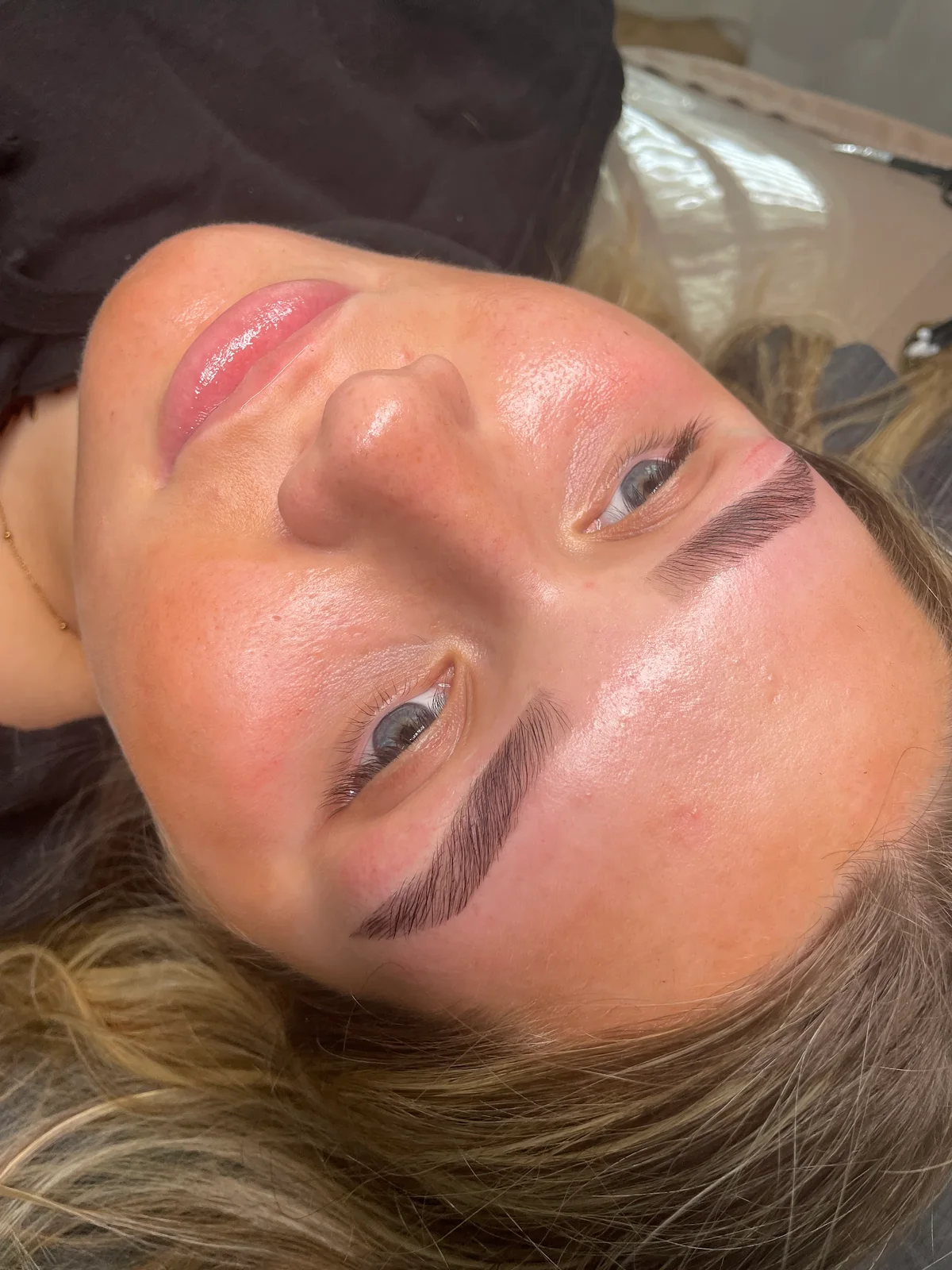 Softly defined brows and natural-looking lashes by Zoë