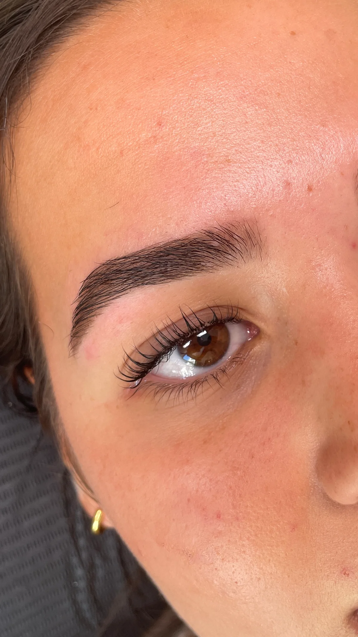 A close view of Zoë's finished lash and brow work